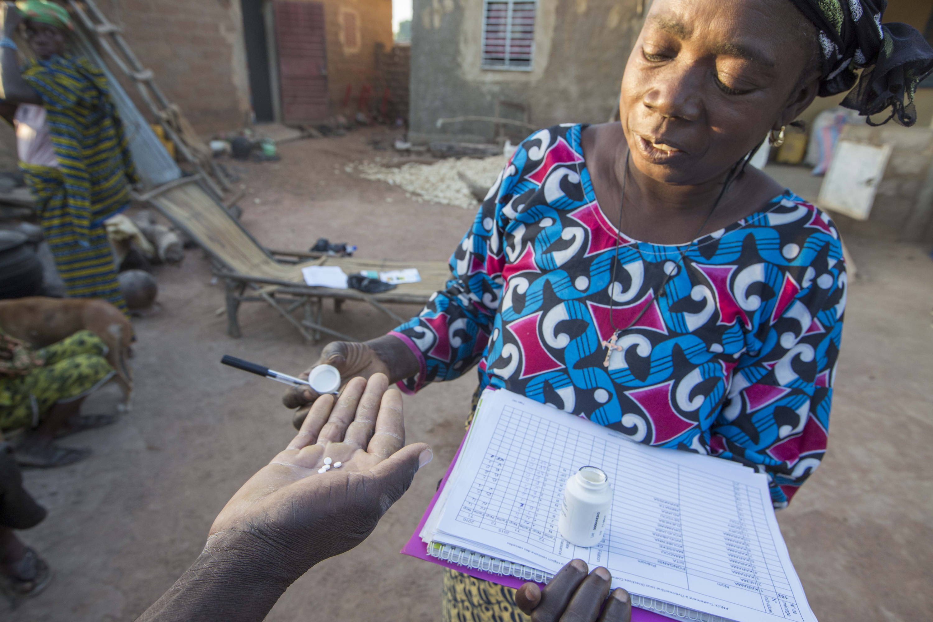 Diane, community drug distributor preparing a dose of Ivermectin