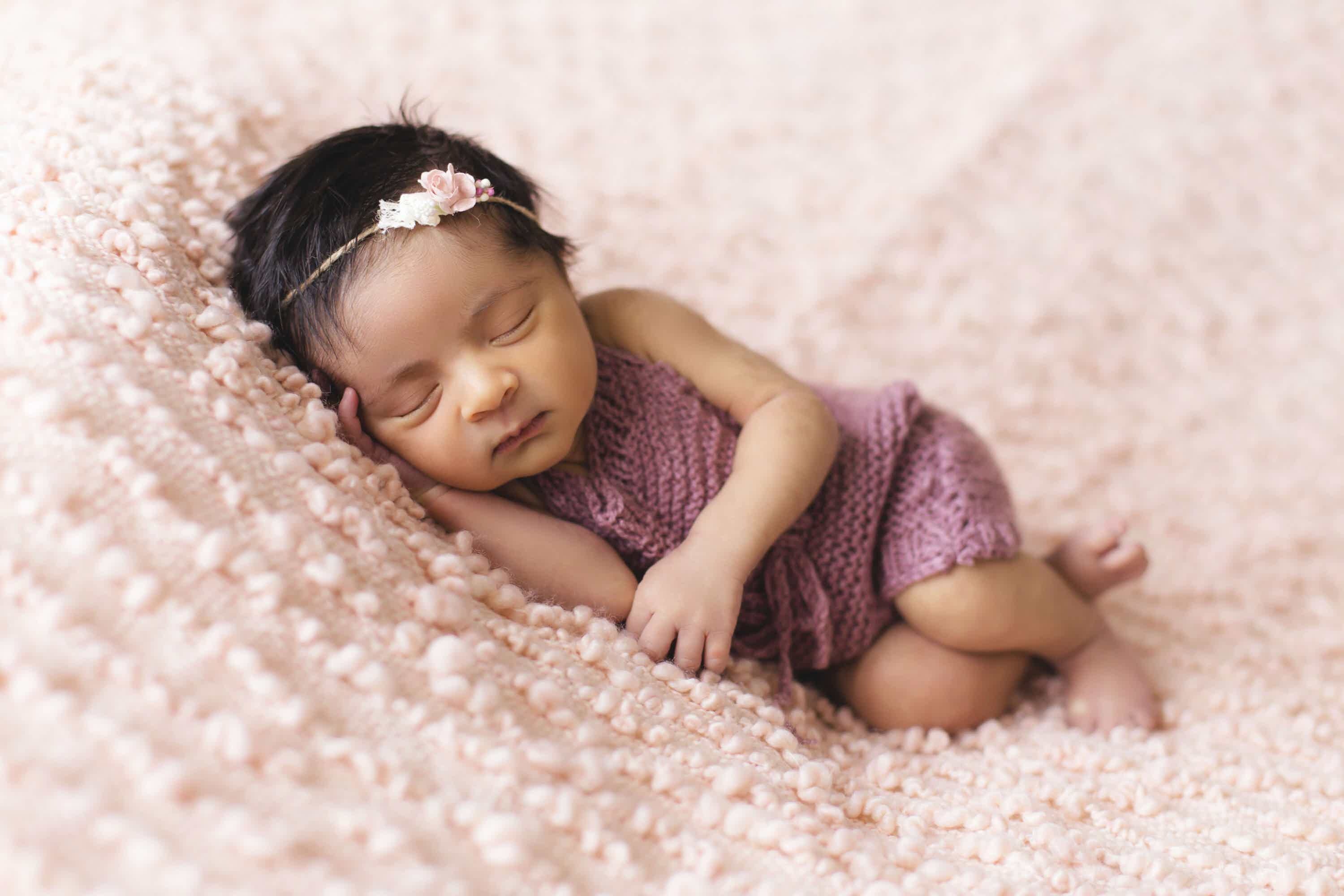 Baby sleeping next to Baby Mood Lamp