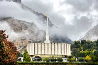 The Provo Temple and mountains rising through the fog.