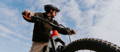 Rider with helmet on Cannondale electric mountain bike