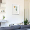 a delicate floral art print in a minimalist living room