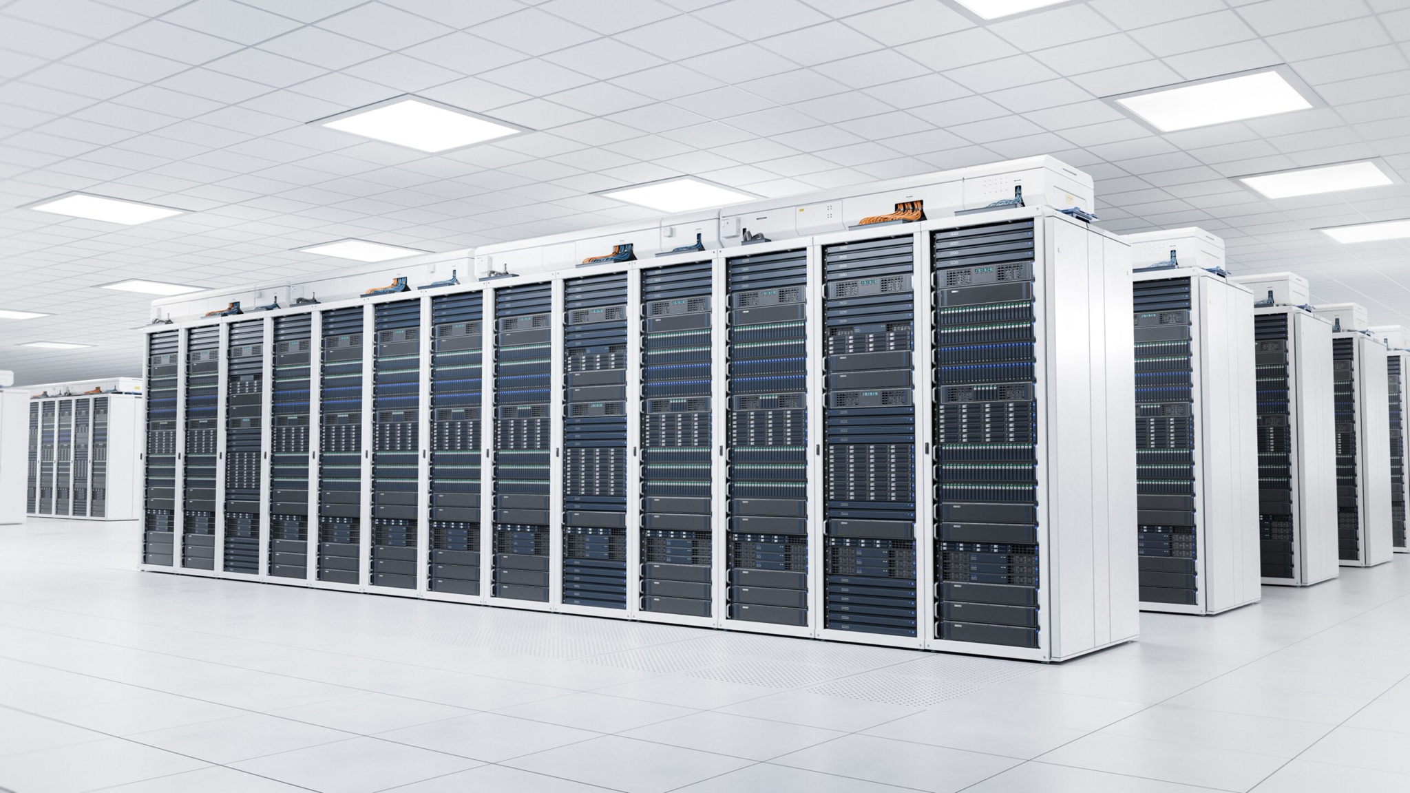 Rows of server racks in a bright, modern data center with white walls, ceiling, and floor; the racks are filled with networking equipment and cables, creating a clean and organized environment.