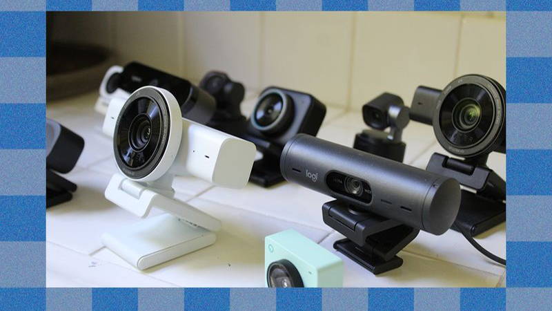 Variety of black or white webcams on white countertop
