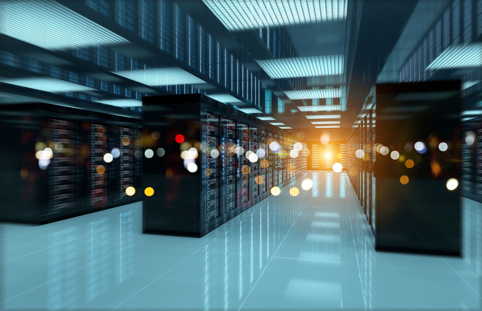 A modern data center with rows of server racks, bright overhead lighting, reflective floors, and a glowing light source at the far end, creating a high-tech, futuristic atmosphere.