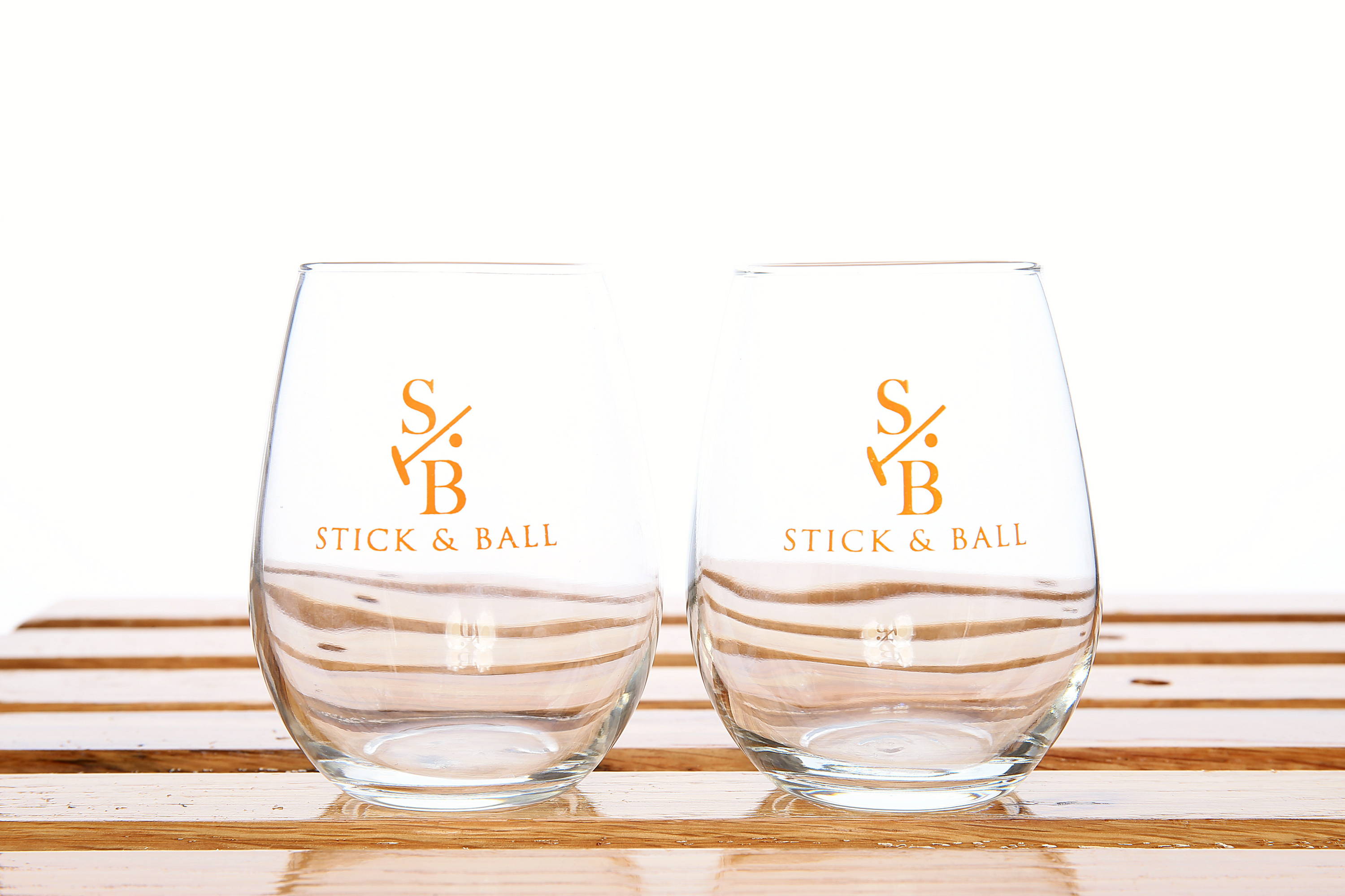Stemless Wine/beverage glass with Stick & Ball logo