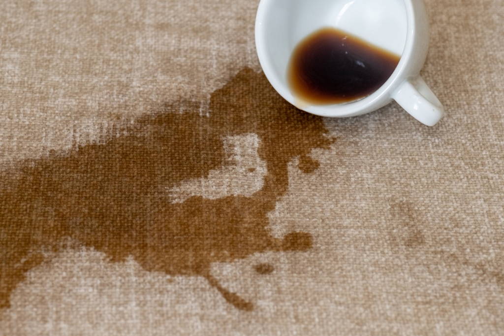 Mug Spilling Coffee on Tablecloth