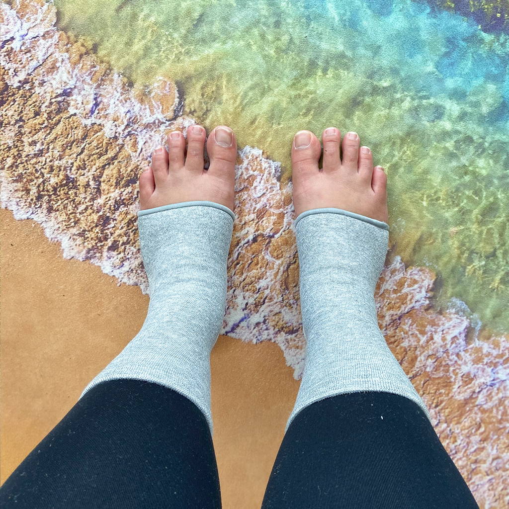 relieve foot pains, onecompress bamboo footsleeves, sad woman