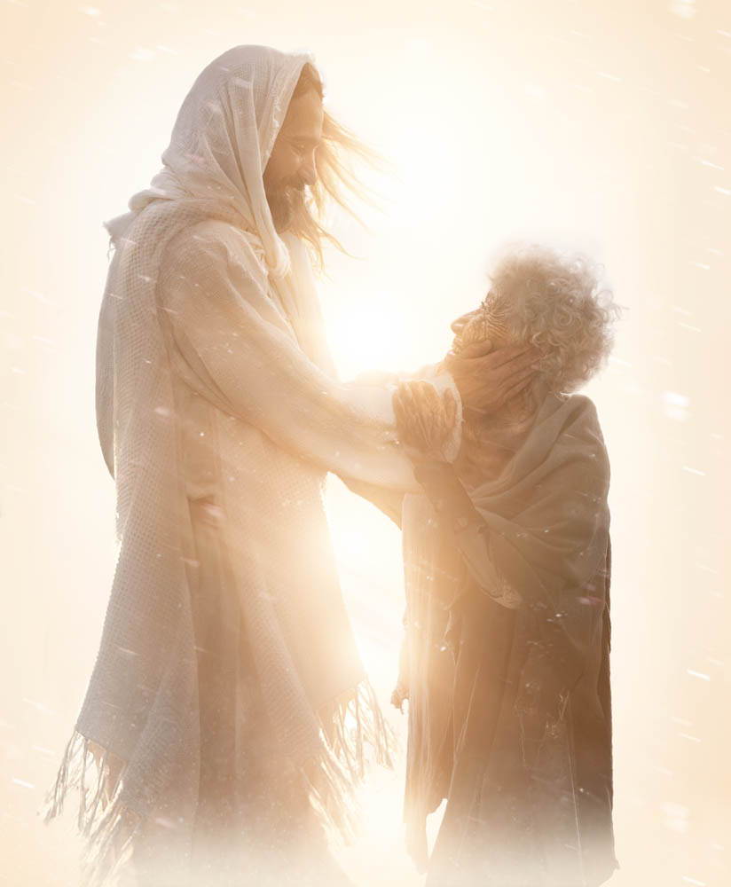 Jesus comforting an older woman. Light shines behind them.