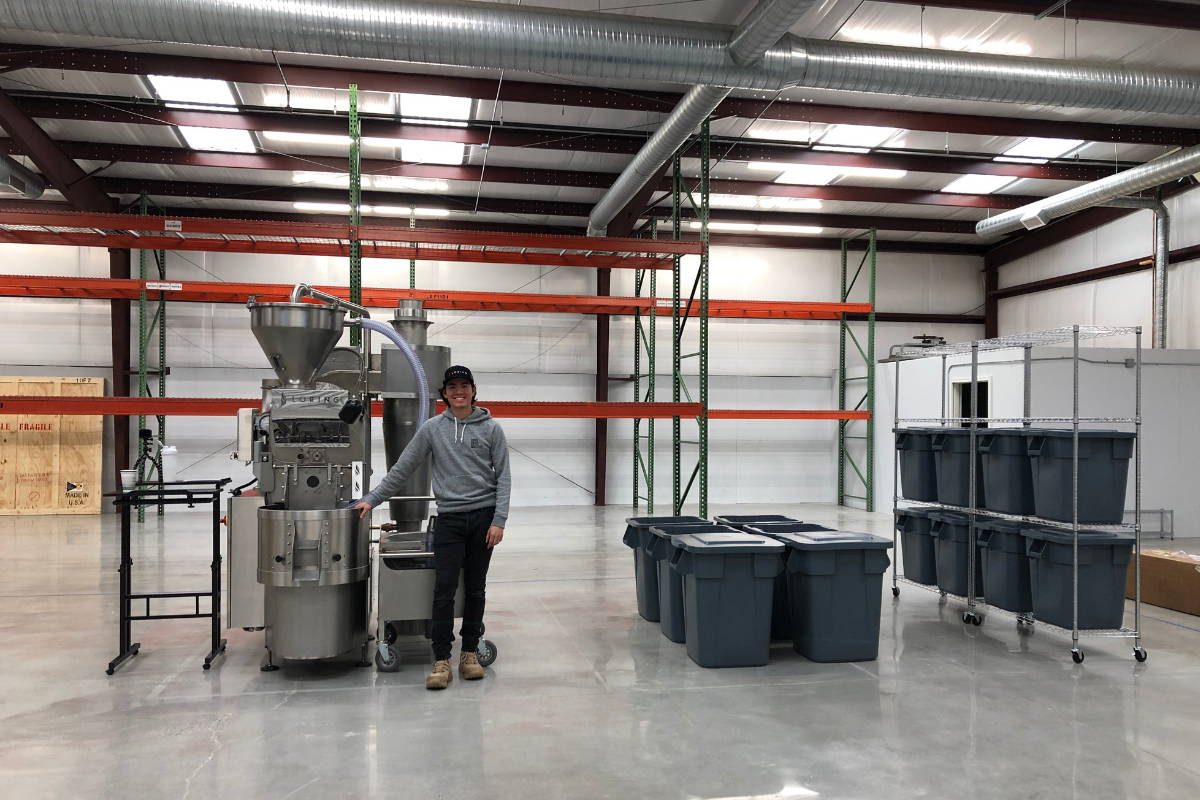 Harry standing beside newly installed roaster.