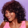 smiling curly haired woman