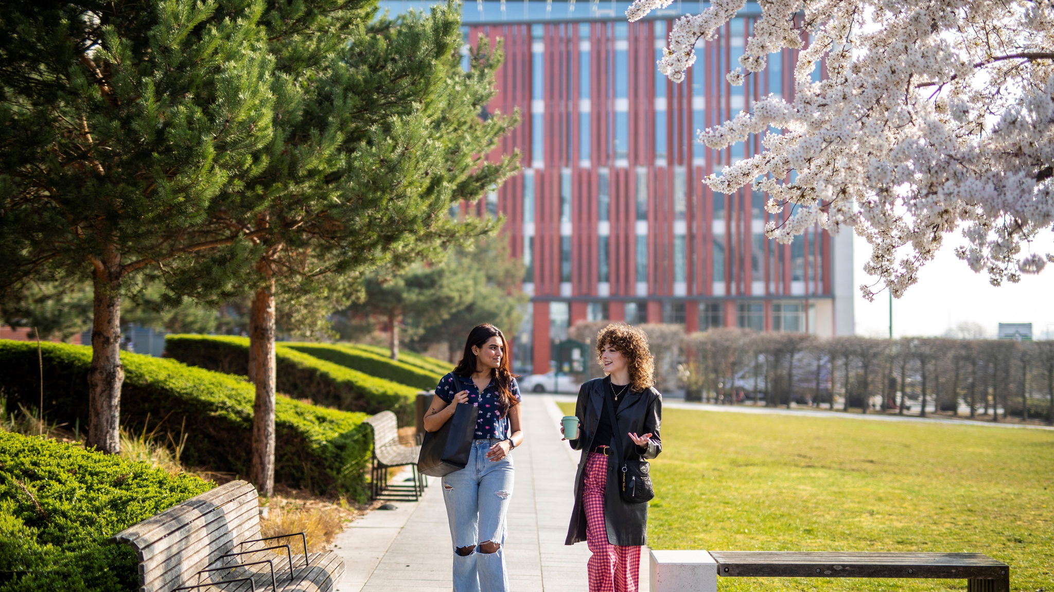 Two students walking at Birmingham university campus
