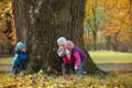 Children playing hide and seek in the park.