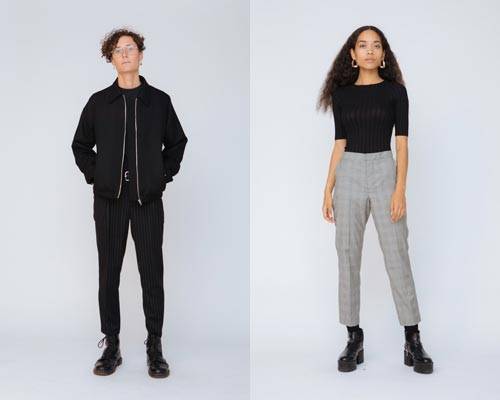 Man wearing black wool jacket and black skinny trousers from sustainable fashion brand Hund Hund and woman wearing organic cotton ribbed top with cropped grey trousers