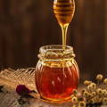 raw-honey-dripping-from-dipper-into-jar