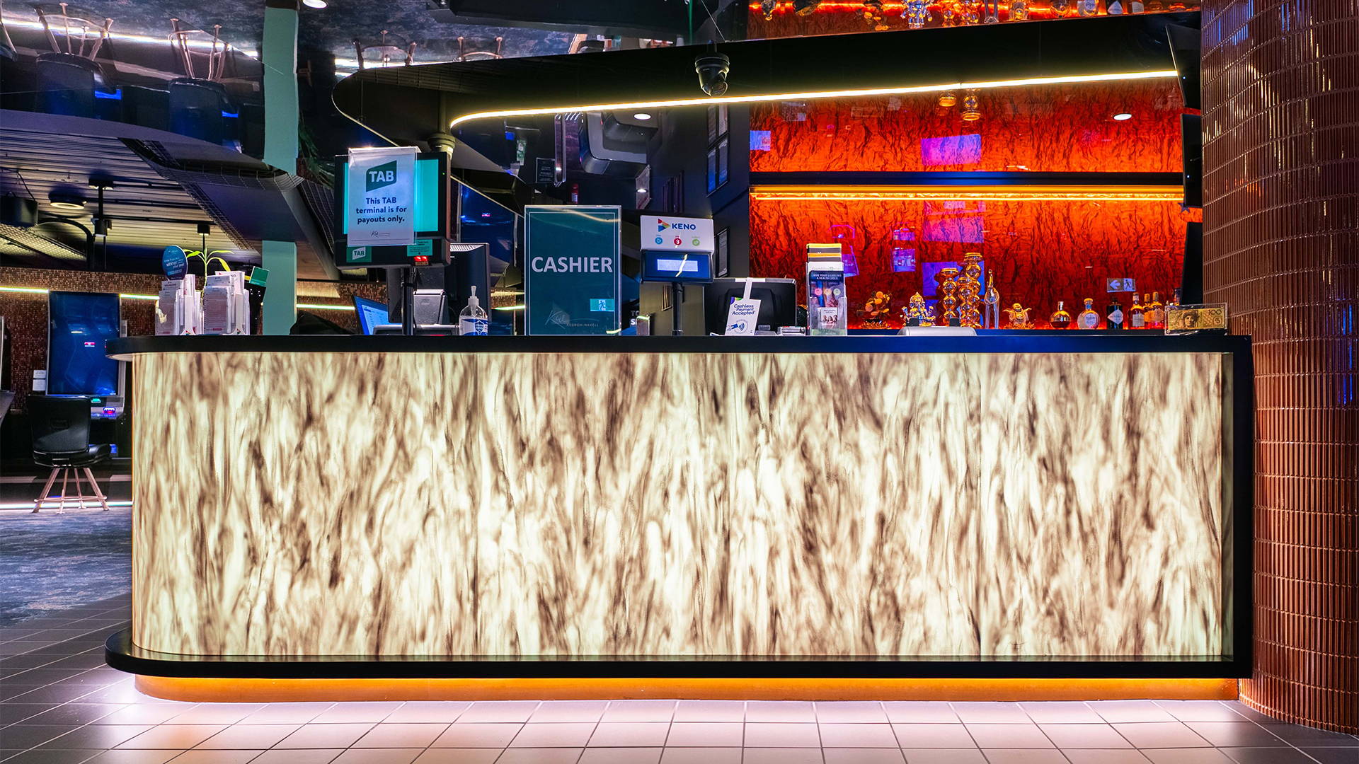 Bar Counter illuminated with LED Panels by Havit Commercial, showcasing a luxe display of the bar counter. The bottom of the counter is also illuminated by LED Strip Lighting by Havit Commercial