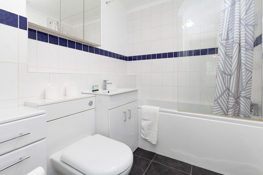 Bathroom with bath and sink, clean modern decor