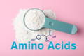 a scoop of white collagen powder on a pink background above the molecular structure of amino acids