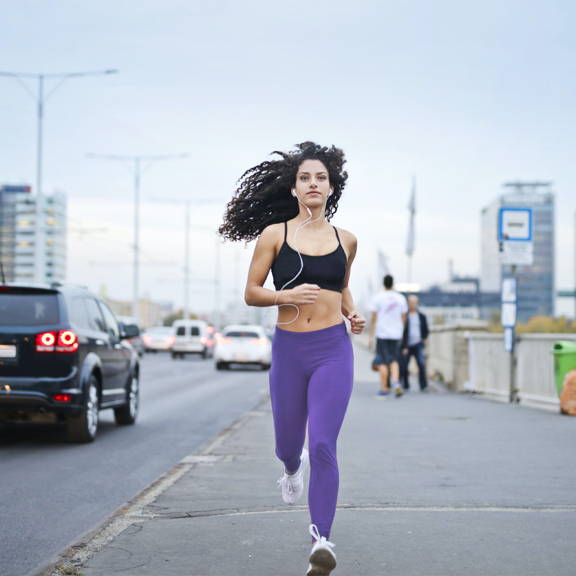 Female runner listening to podcast