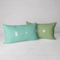 cat paw and nose print pillow in different colors of blue and green