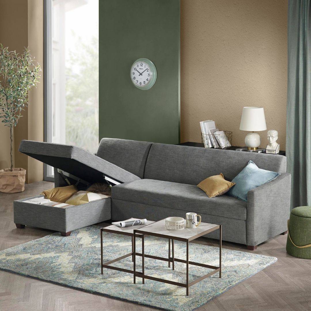 storage chaise in living room with coffee table and cushions