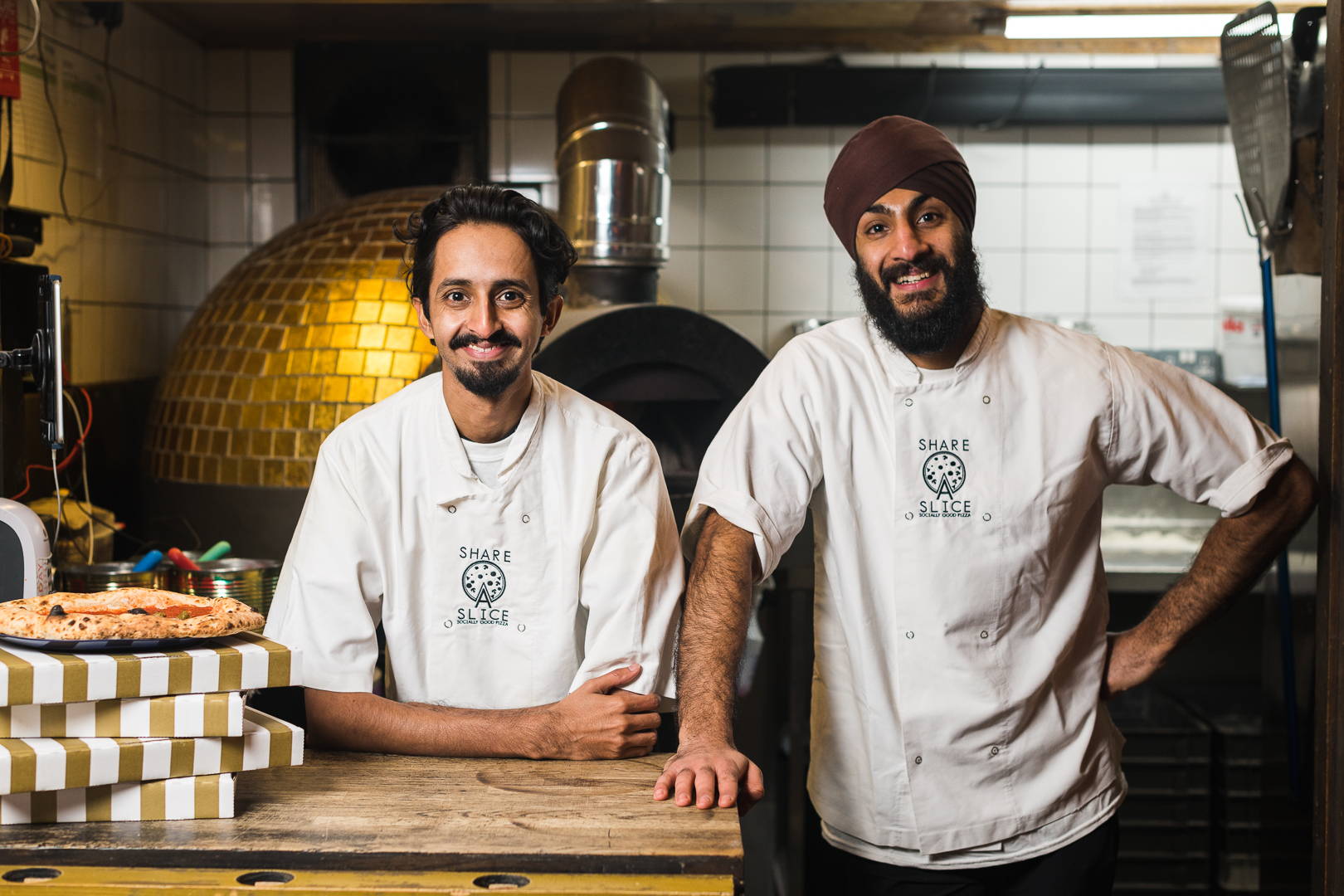 Raj Kambo and Sandeep Kumar, Co-founders of Share A Slice Pizzeria
