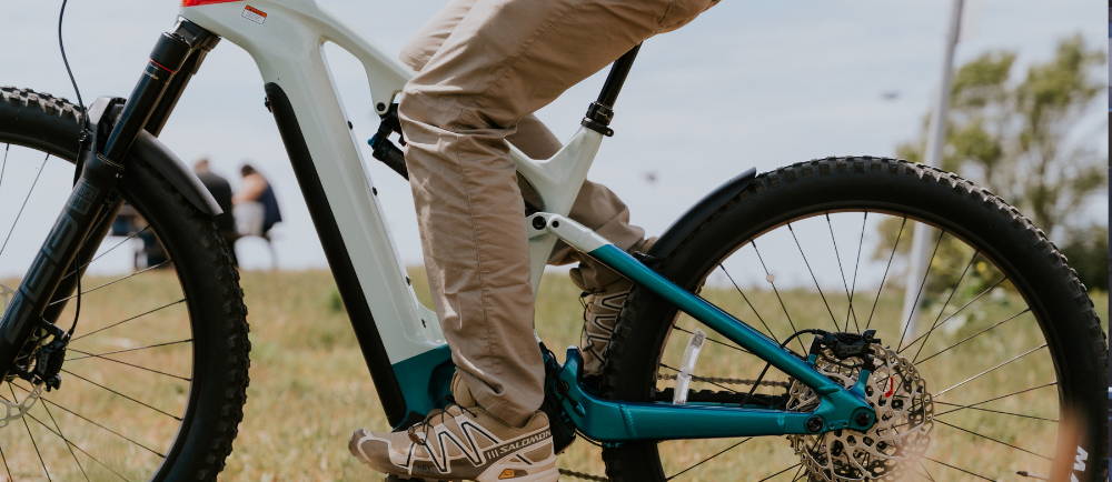 a person on a canondale electric mountain bike