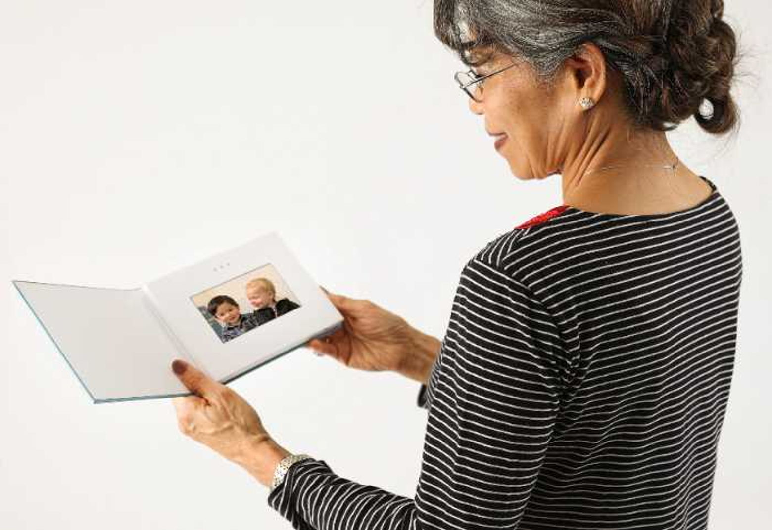 Woman holding video book