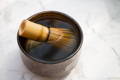 HIROMI Chawan pre-season whisk in matcha bowl of hot water
