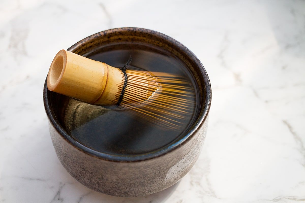 Pre-season matcha whisk in bowl of hot water