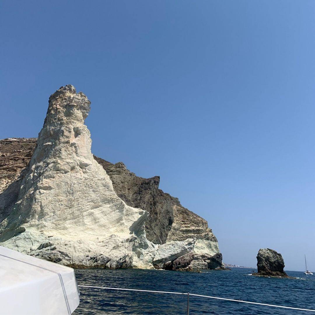 Cavotagoo infinity pool overlooking Santorini caldera at sunset