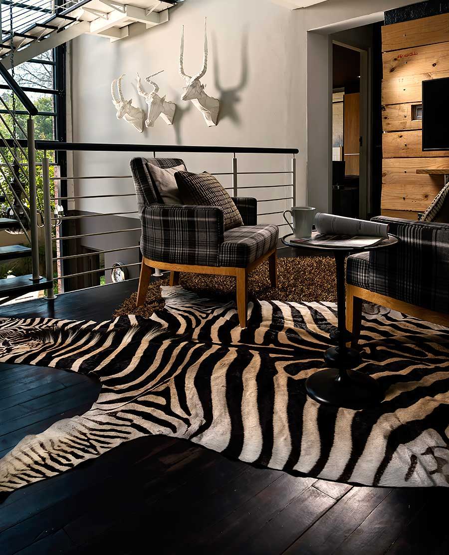 Zebra rug slide in a home decor setting