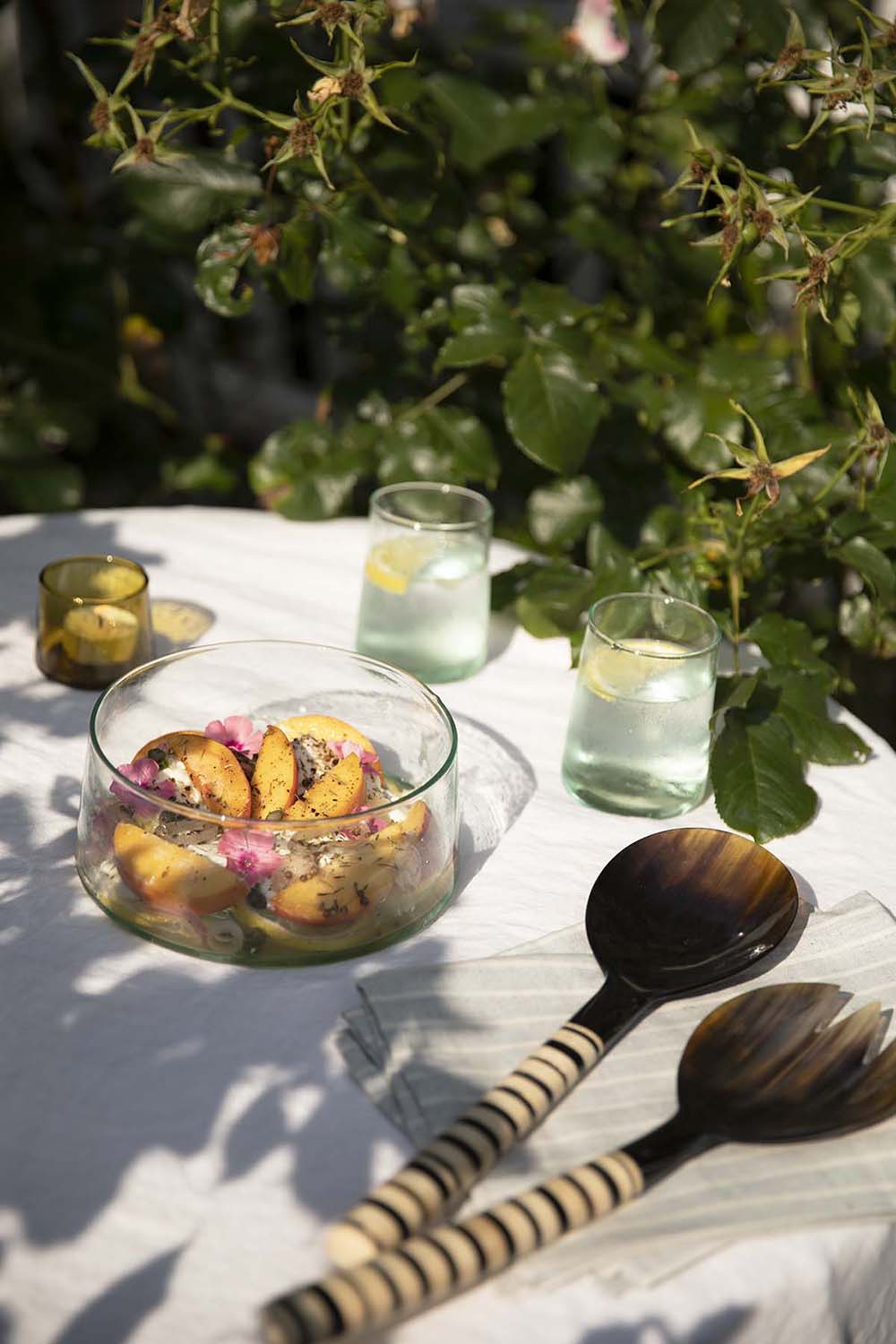 Sustainable summer tablescape featuring ethically made homeware from moroccan brand Socco Designs, Haiti Design Co and Meema cotton napkins