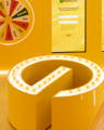 Curved Garnier product counter highlighted with integrated Havit Lighting LED strip.
