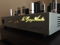 McGary Audio SA 1 Vacuum Tube Stereo Amplifier showing the backlit company logo in dark ambient lighting
