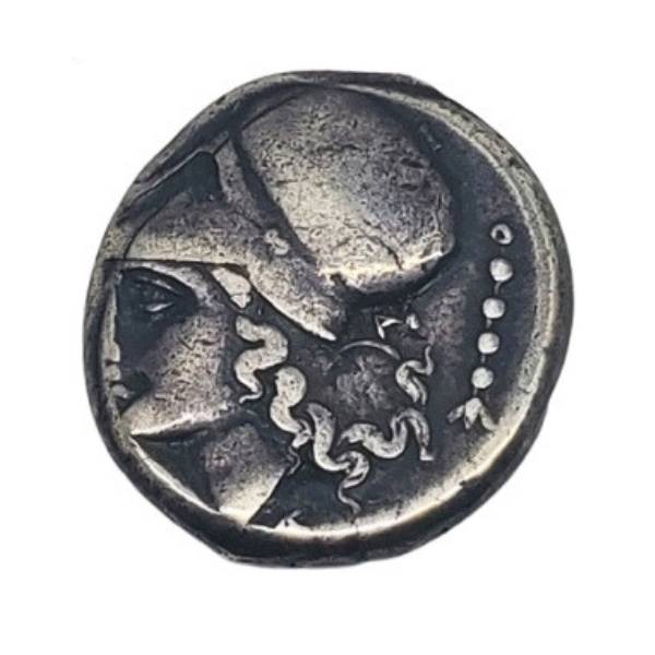 Ancient Greek silver coin from Corinth with an image of Athena