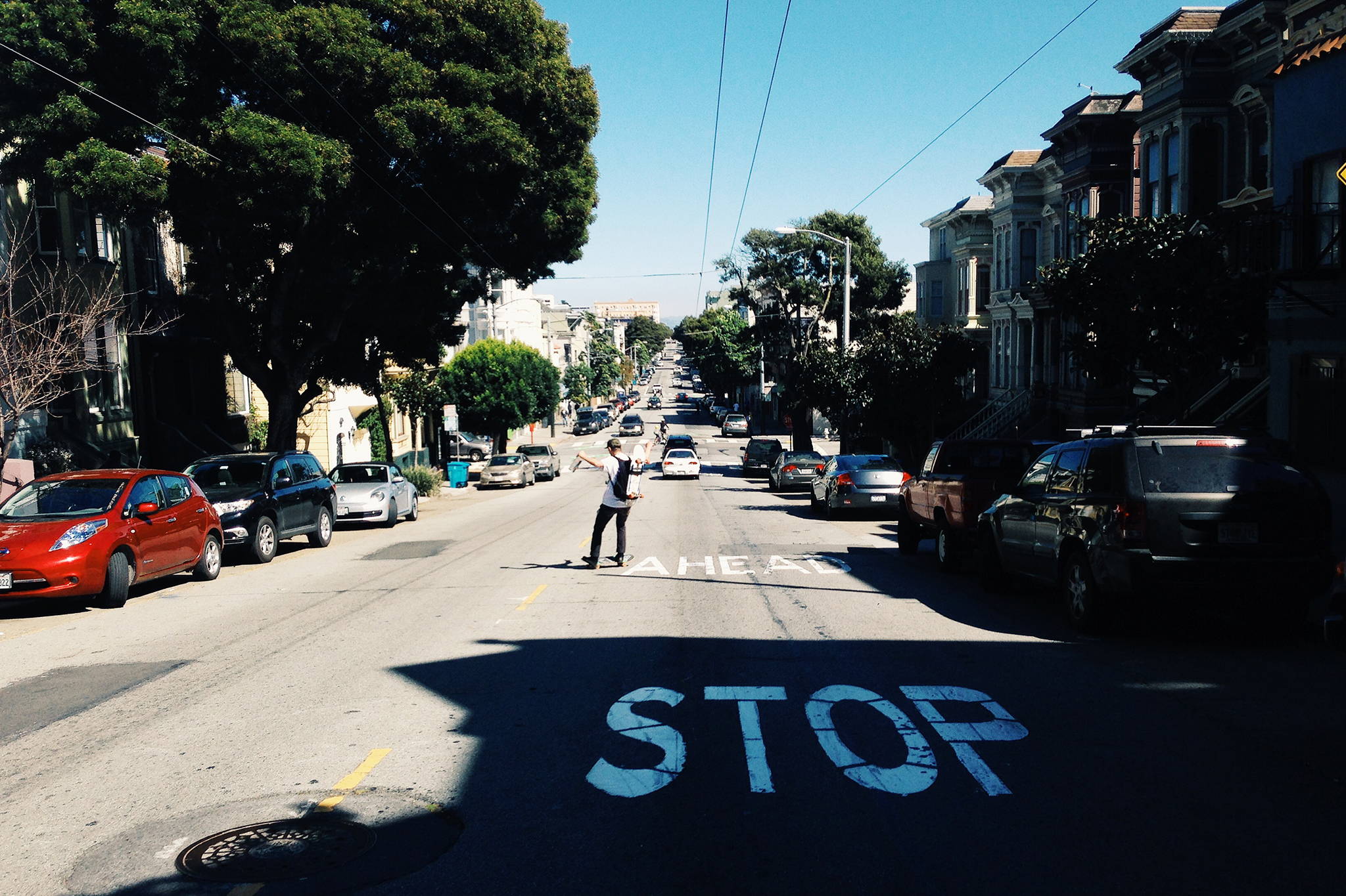 Man skateboarding in the middle of a San Francisco street