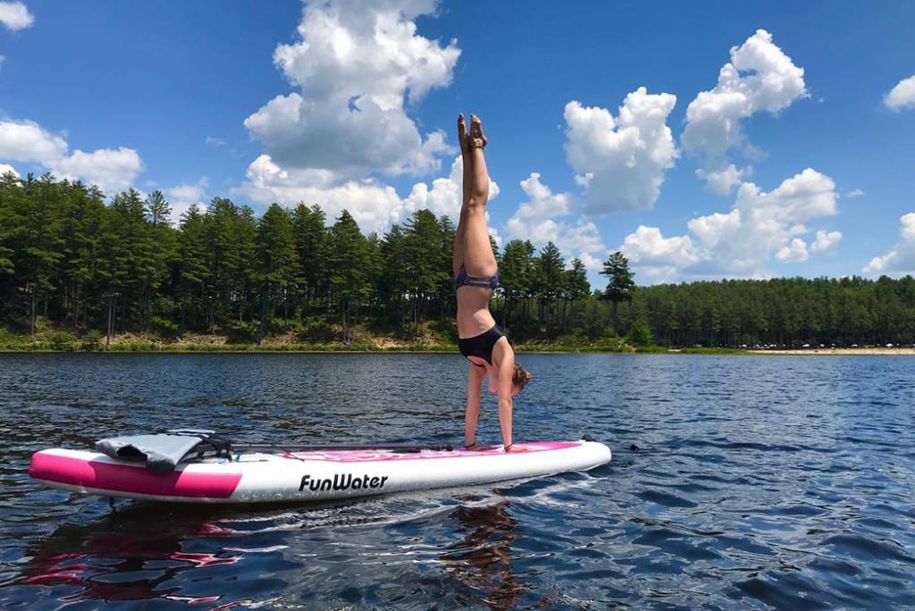 Yoga SUP board on Canada calm lake