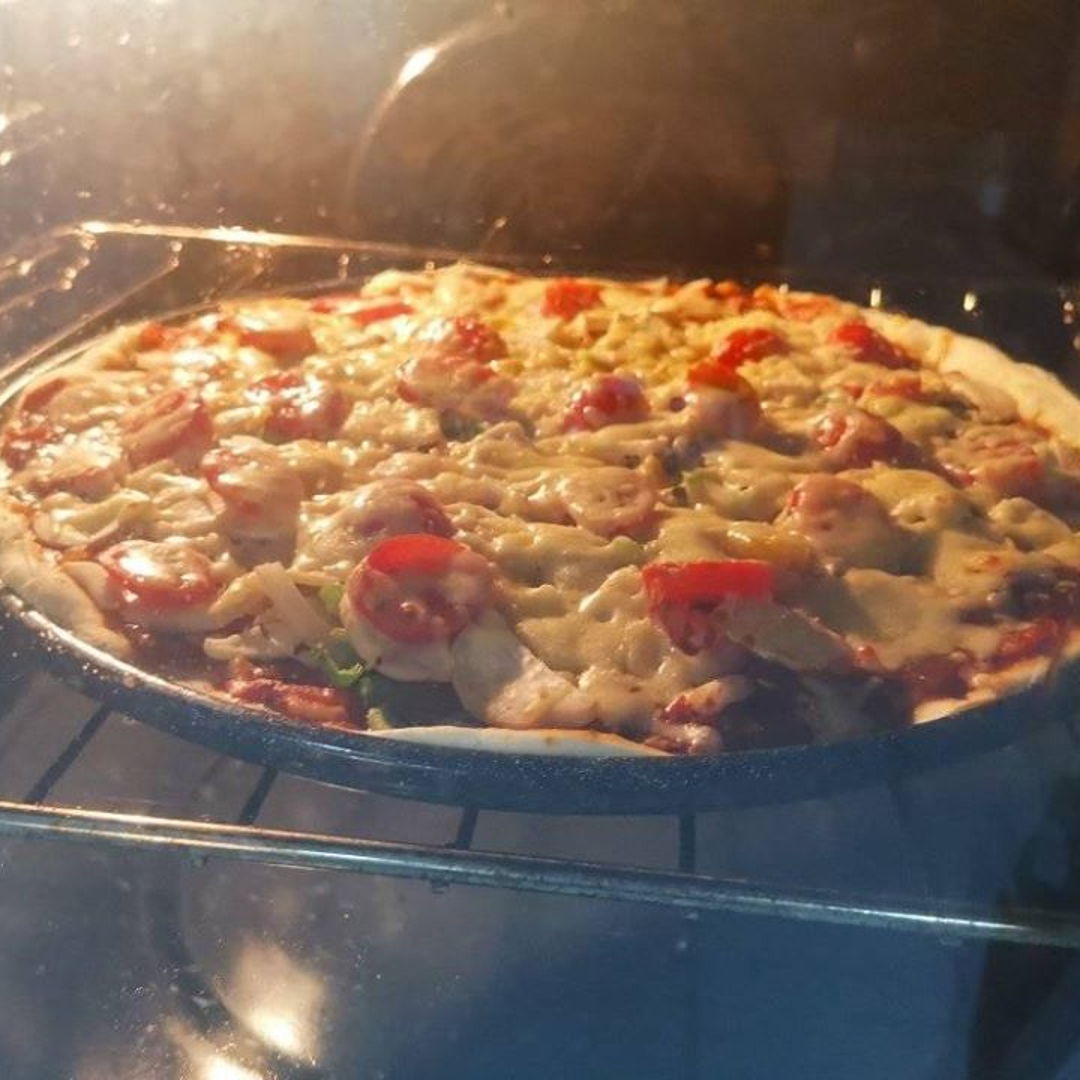 homemade thin crust (yeast crust) pizza made by Pru & I