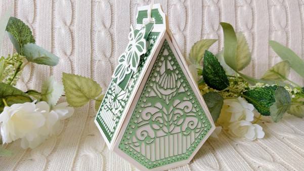a green and white triangular shaped box