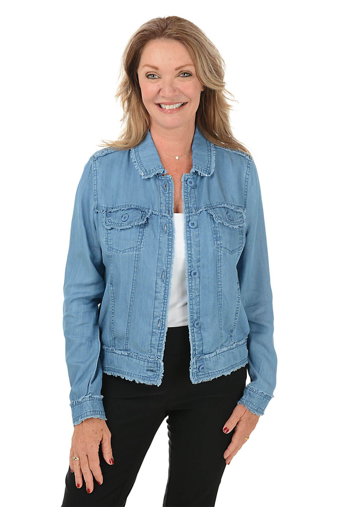 A woman wearing a blue denim jacket over a white top and black pants