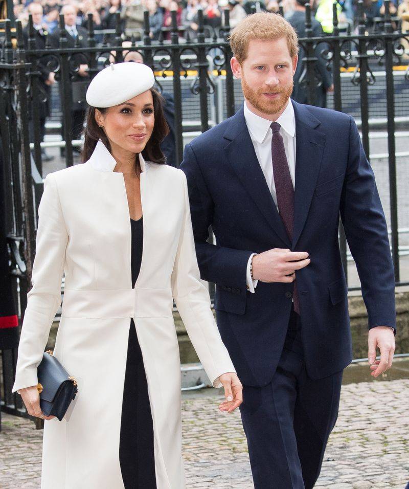Image may contain: Prince Harry, Duke of Sussex, Meghan, Duchess of Sussex, Person, Adult, Clothing, and Coat