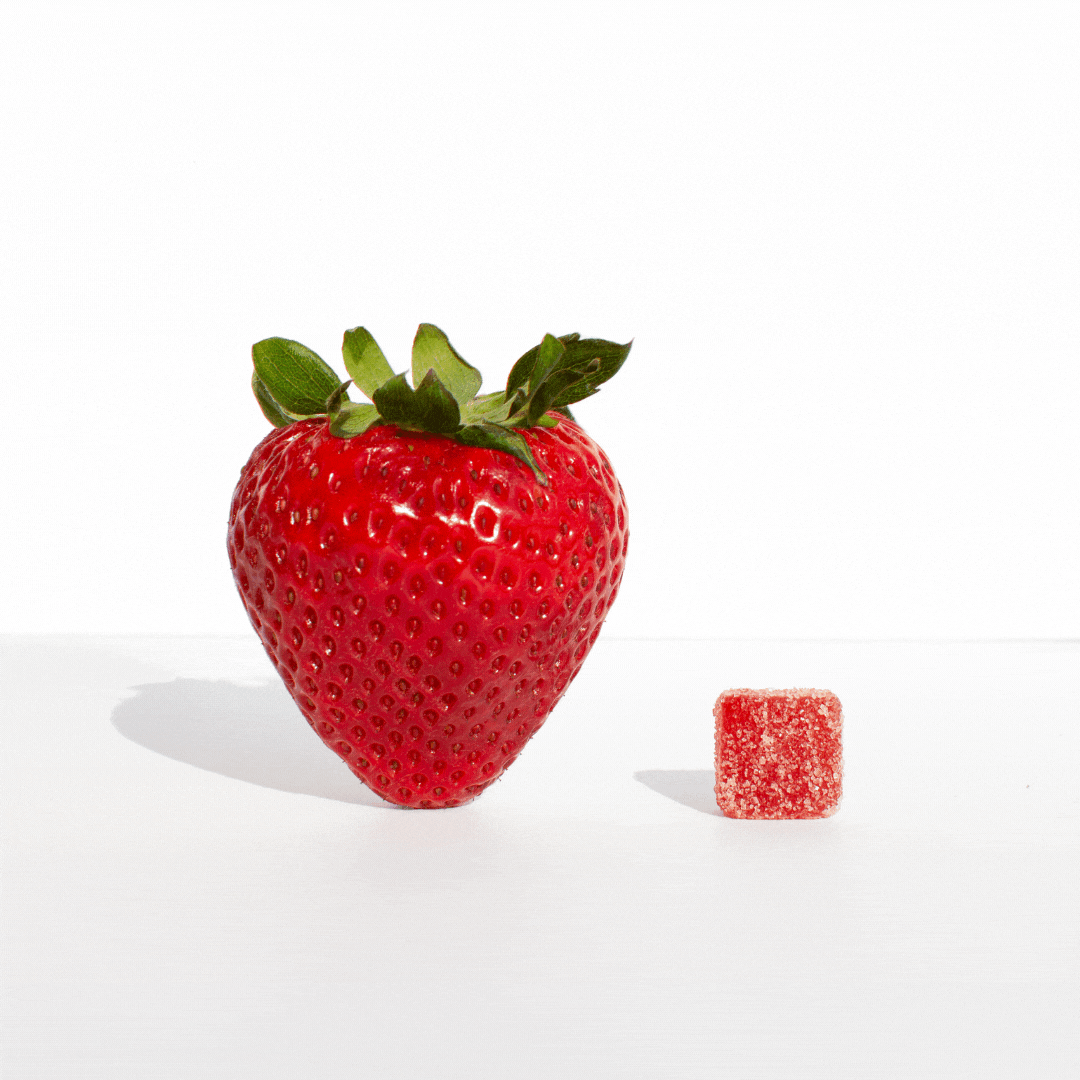 a red strawberry and a small red strawberry