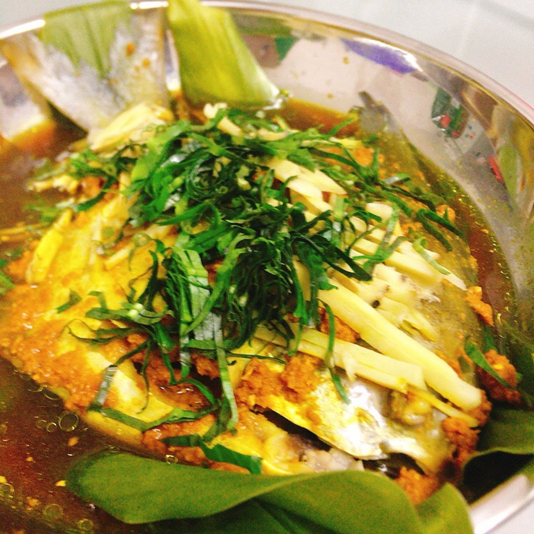 steamed fish with kunyit (turmeric).