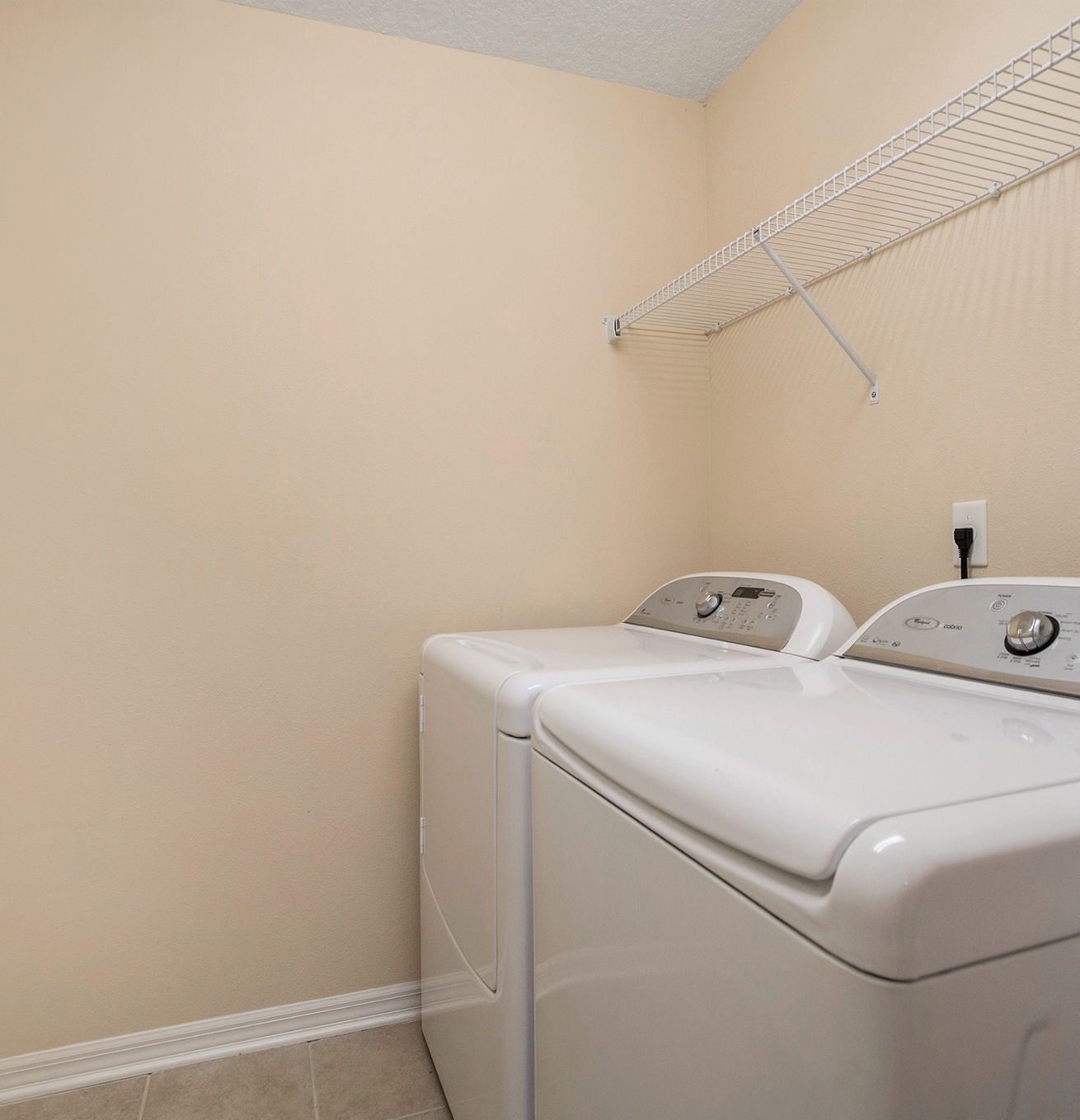 laundry area with independent washer and dryer