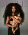 A woman holding a baby on the front cover of the march 2022 issue of Vogue magazine