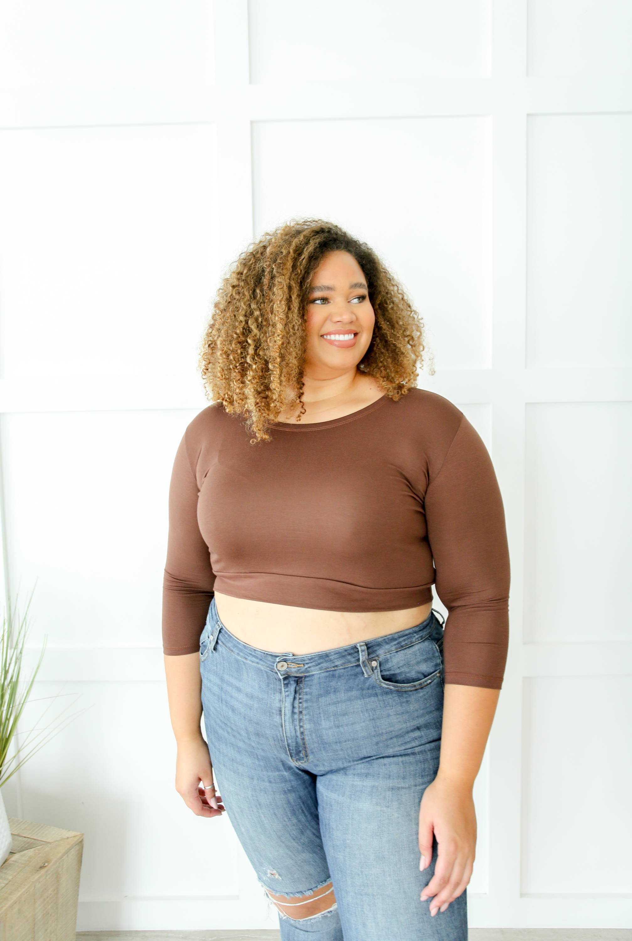 A woman wearing a beautiful dress with mid sleeves