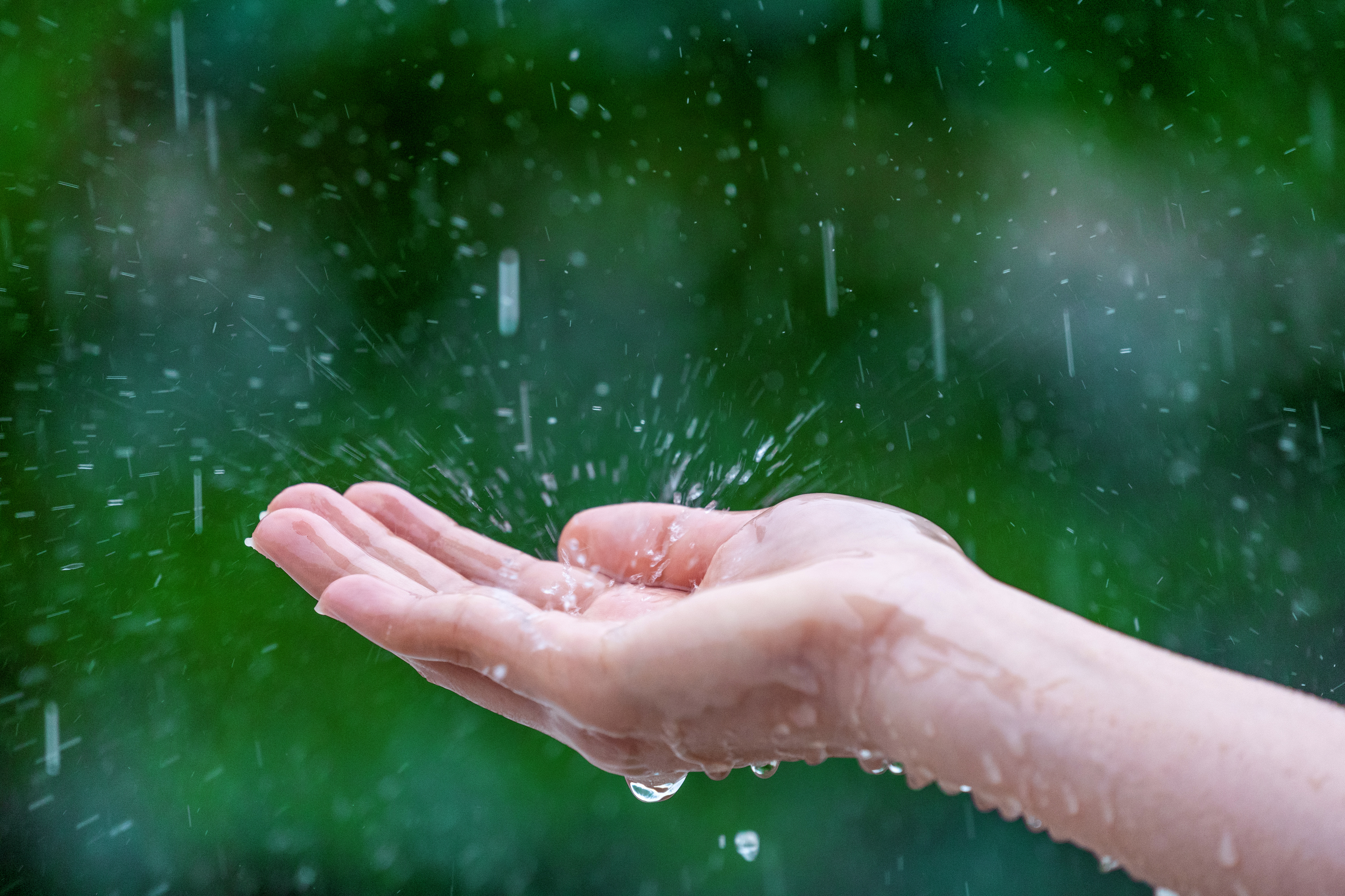 Raindrops being caught in an open hand