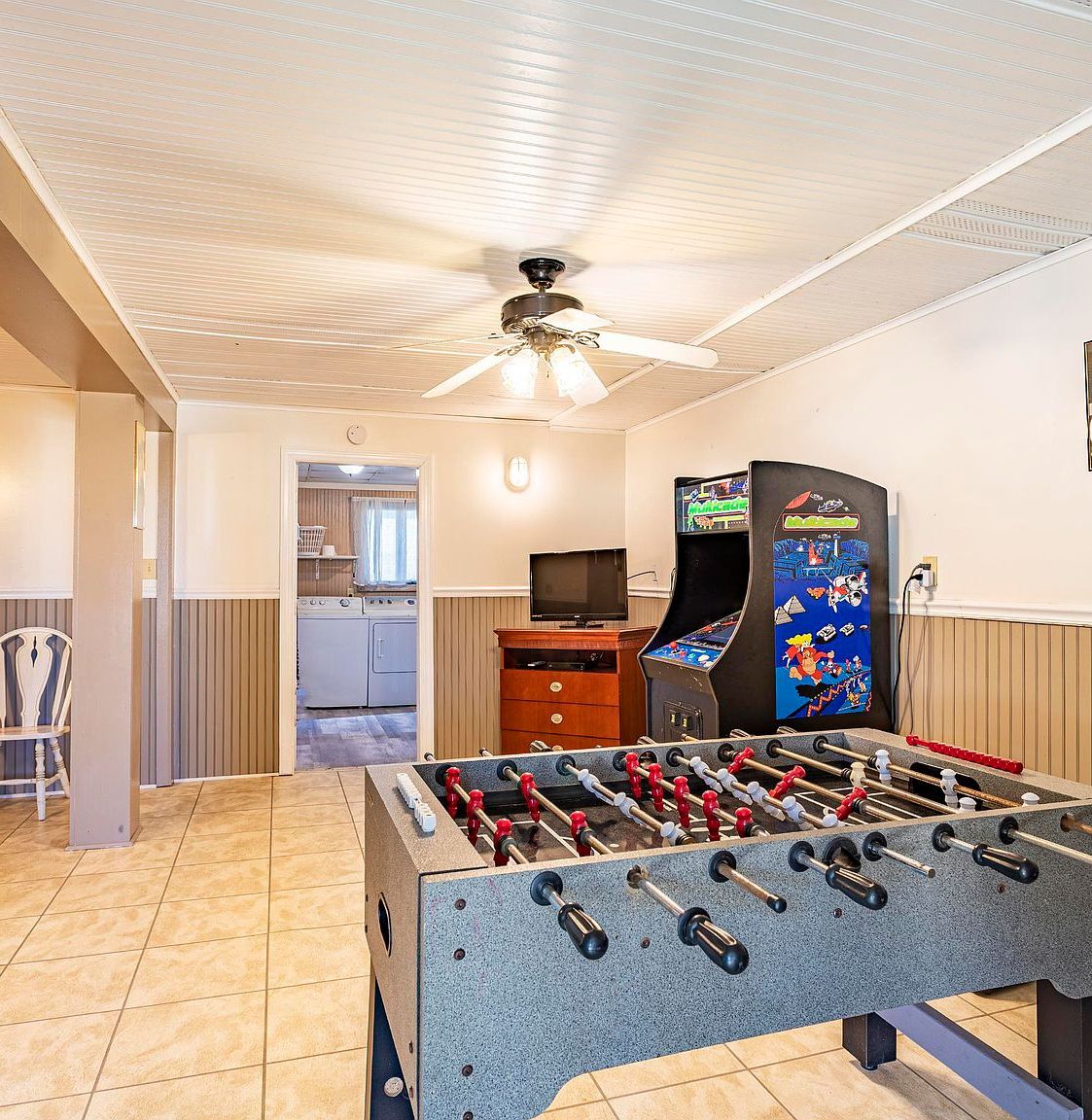 recreation room featuring ceiling fan and light tile floors