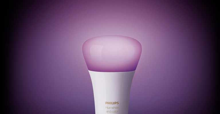 a Philips Hue lightbulb on a purple background