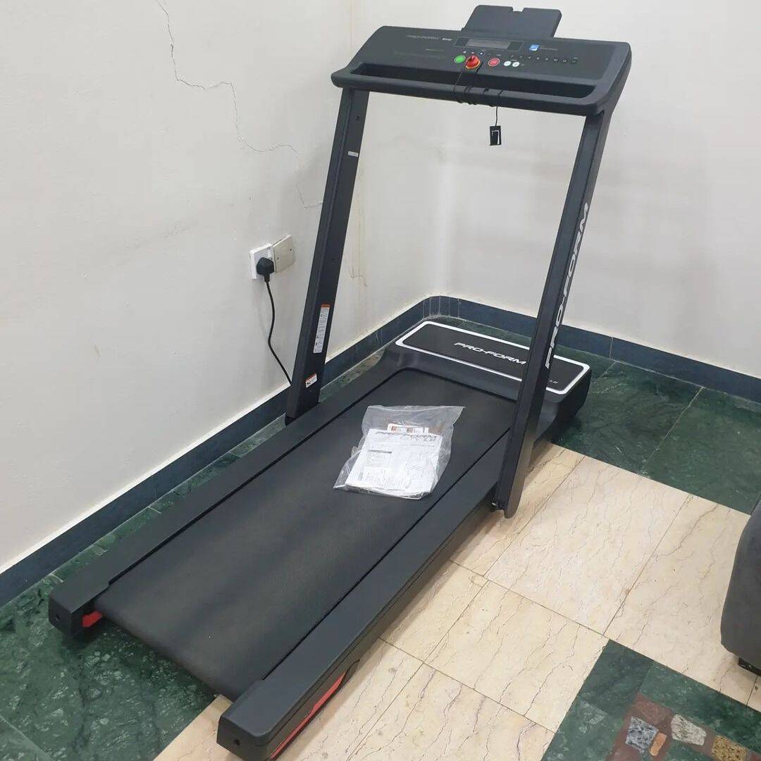 proform city l6 treadmill in a room